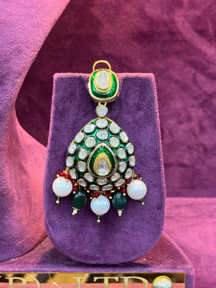 Decorative polki earring on a purple stand with a pink background SP. jeweller&