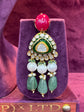 Ornate Polki earring with gemstones on a purple stand "SP. Jewellers"