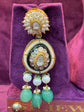 Polki earrings earrings with green and gold elements on a purple cushion "SP. Jewellers"
