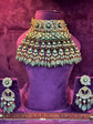 Polki  necklace and earrings set on a purple stand with a textured purple background "SP. Jewellers"