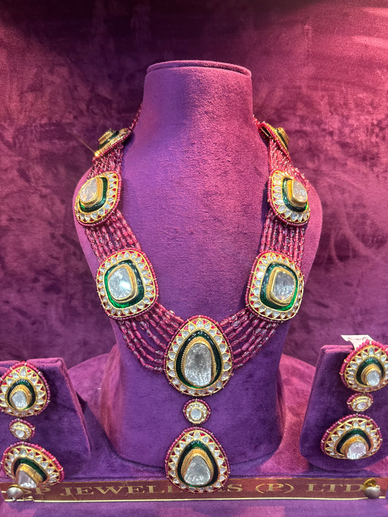 Polki long necklace on a purple mannequin with a pinkish-purple background "SP. Jewellers