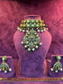 Polki Jewelry set with necklace, earrings, and ring on a purple stand with &